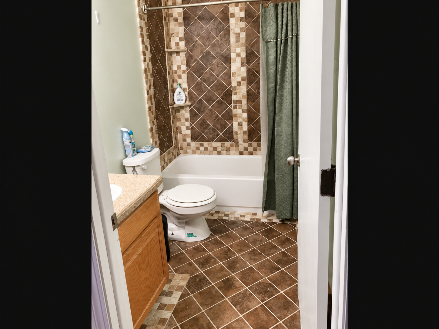 Bathroom with bathtub, tiled walls, and tiled floor
