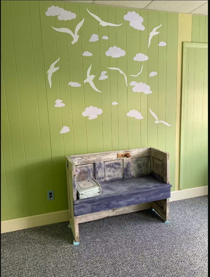 Coastal sitting nook with painted wall details