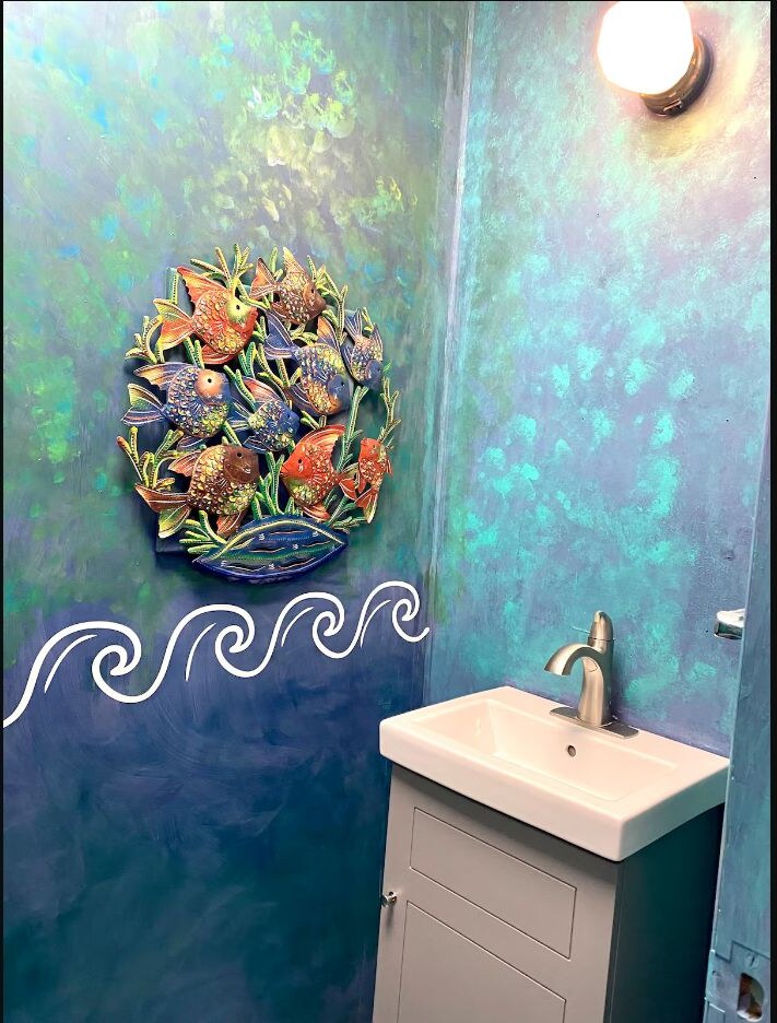 First bathroom vanity with colorful fish artwork
