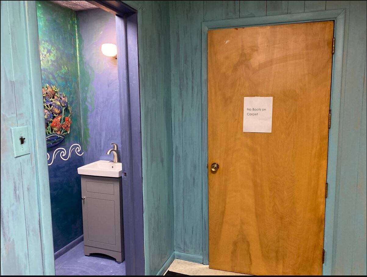 Hallway showing access to both bathrooms