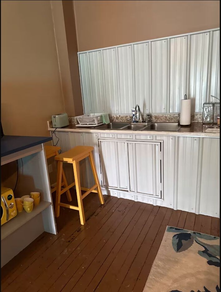 Blue bathroom with sink and toilet