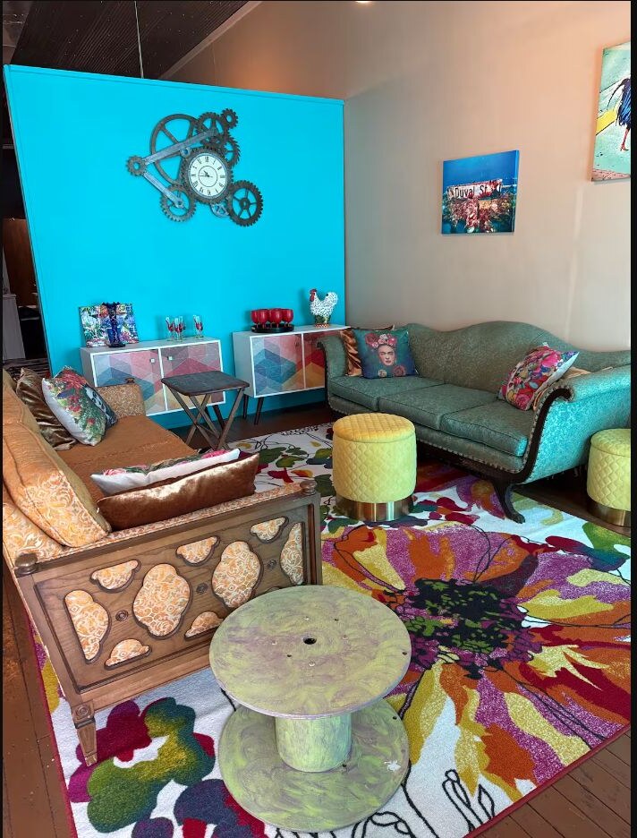 Second living area with turquoise wall and colorful furnishings
