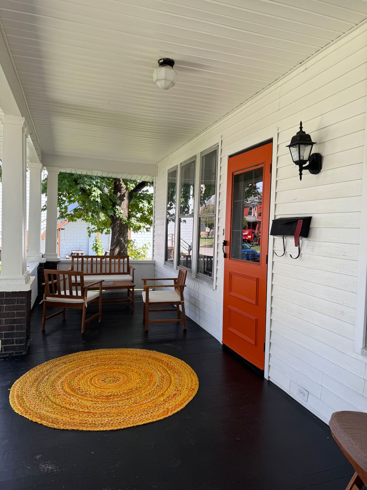 Covered Craftsman front porch with seating