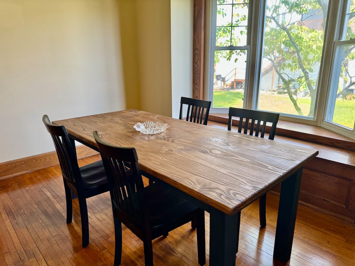 Formal dining room with Craftsman table and bay window