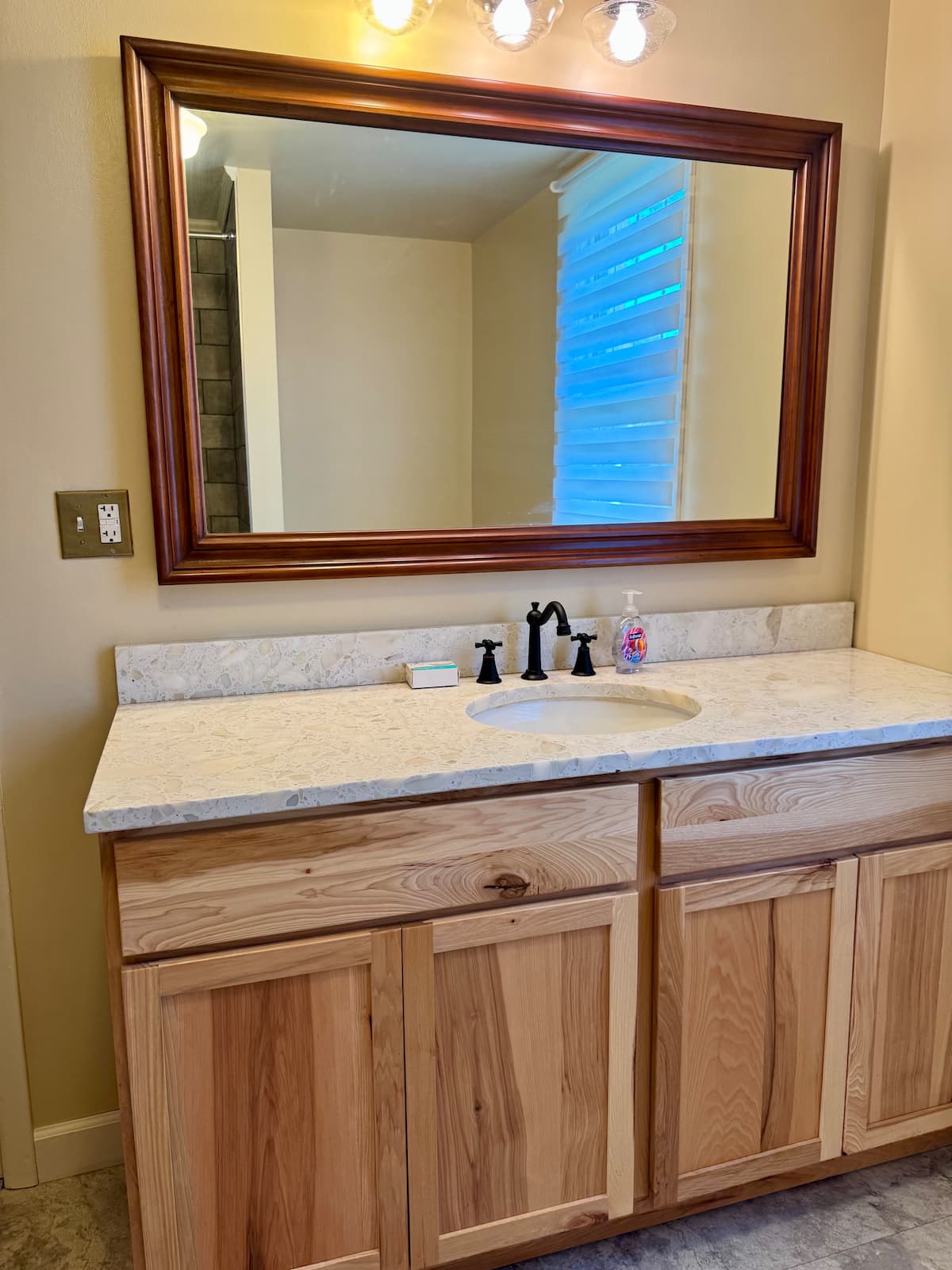 Bathroom vanity with hickory cabinet and quartz top