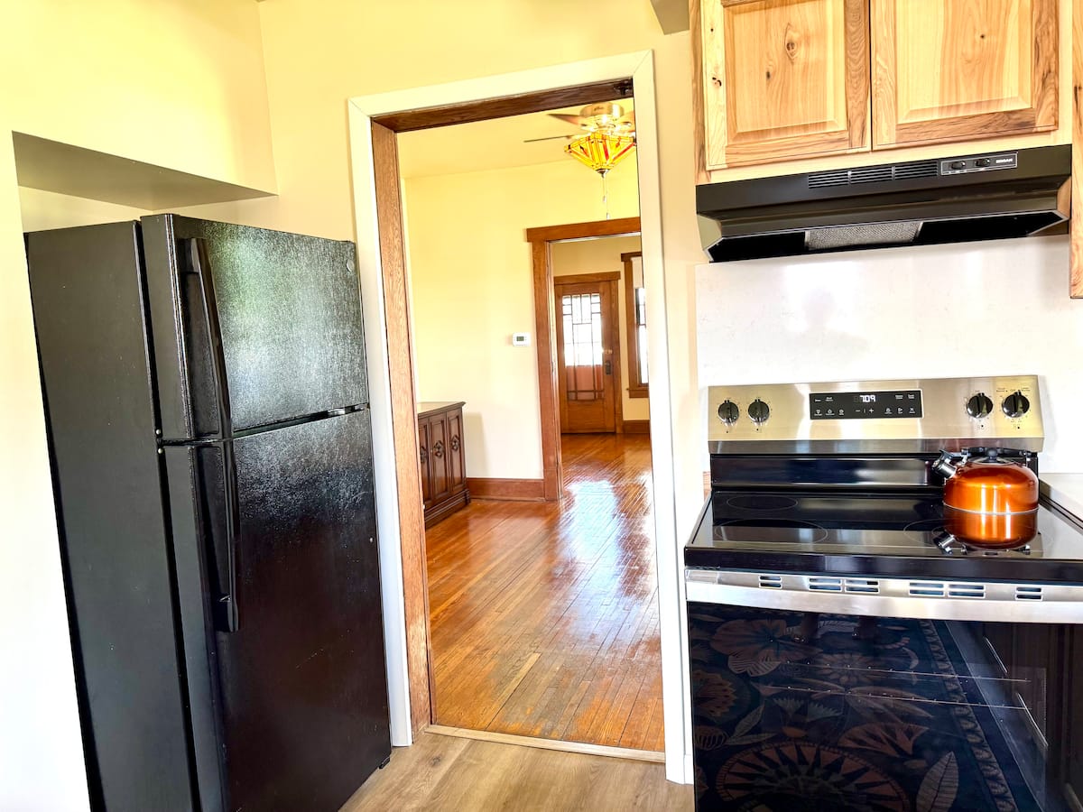 Kitchen range and refrigerator from the dining room doorway
