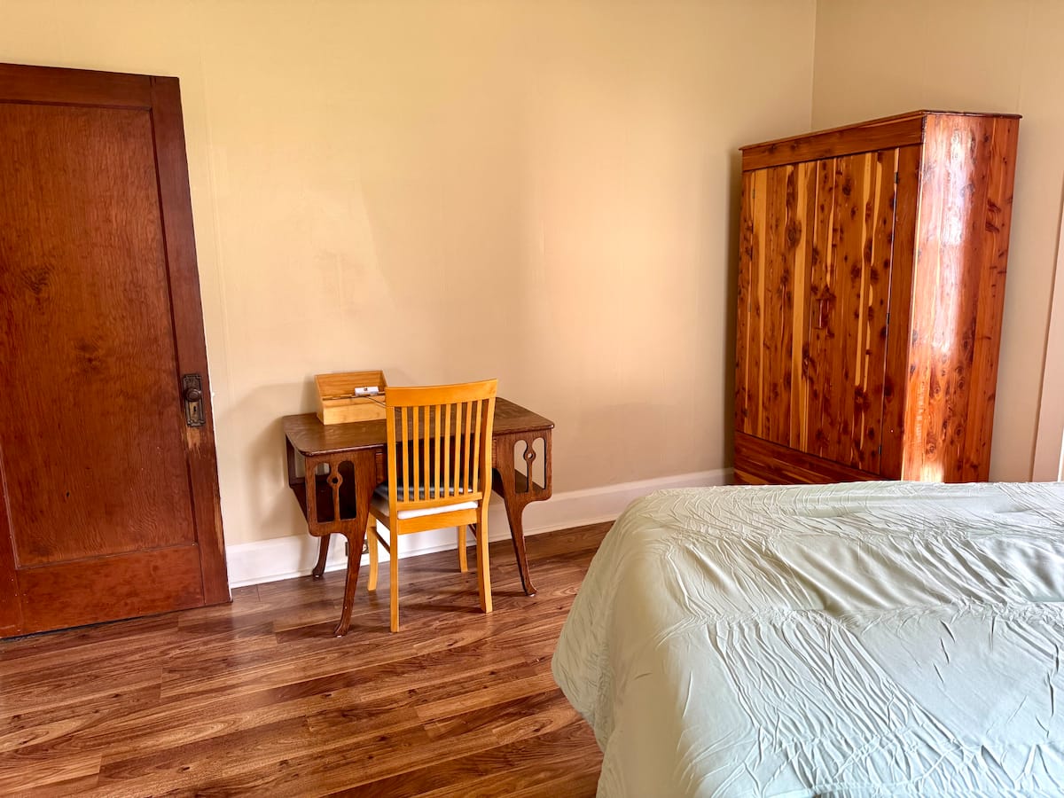 Bedroom writing desk and antique wardrobe