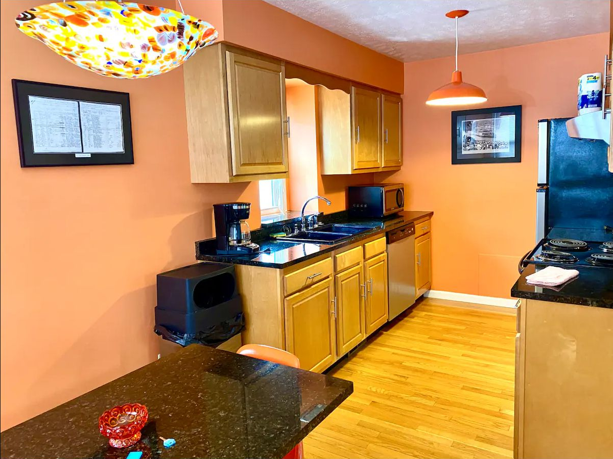 Full kitchen with wood cabinets, granite counters, and stainless appliances