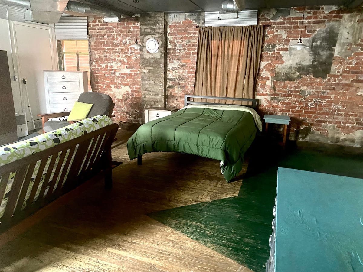 Queen bed in the open concept studio