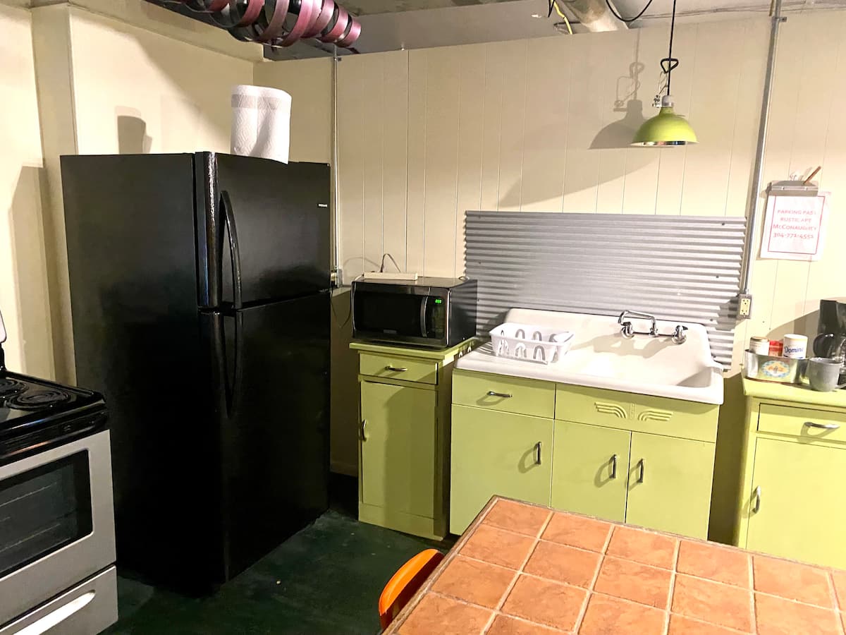 Full kitchen with refrigerator and stove